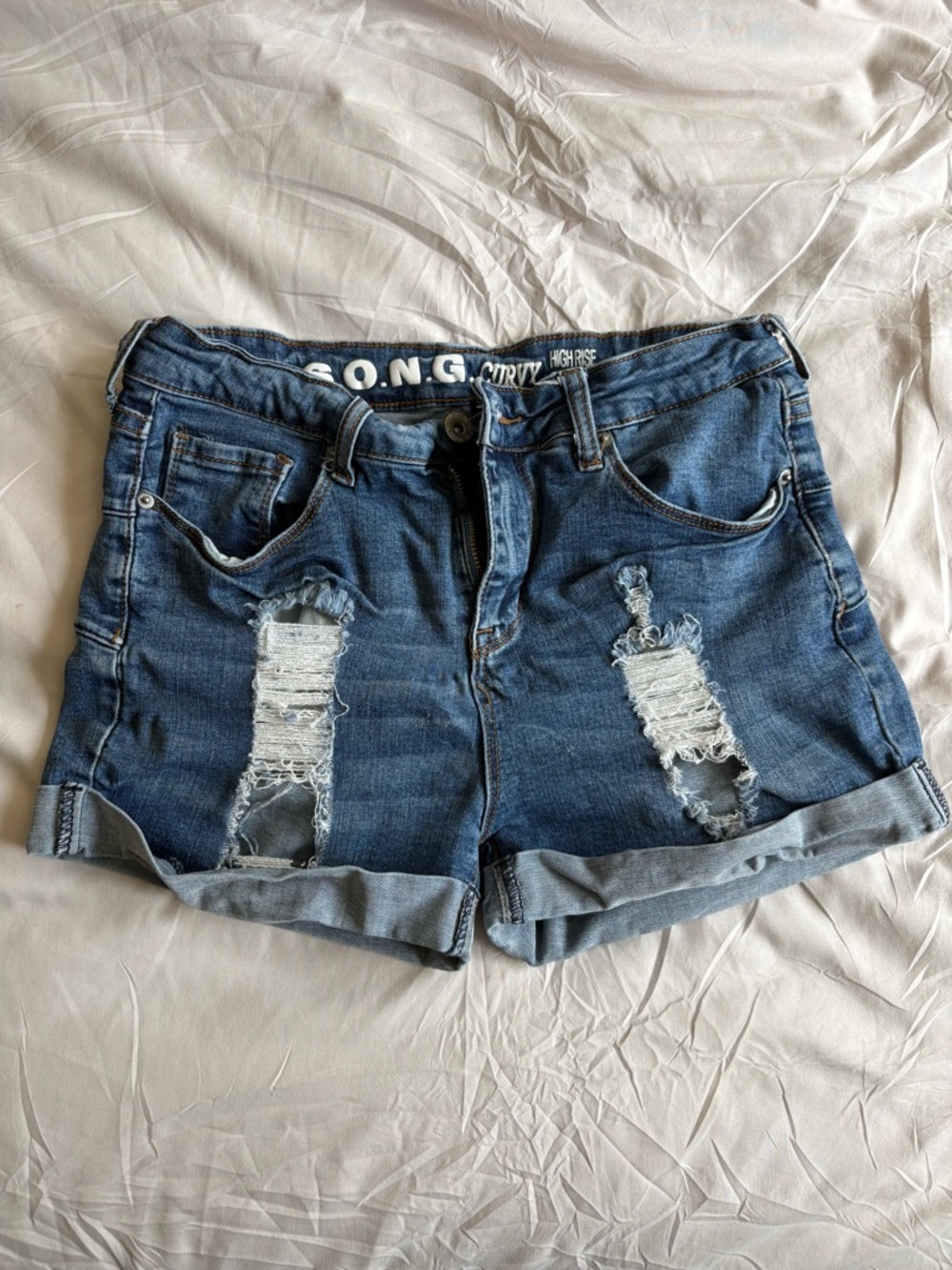 High Rise Distressed Stretch Denim Shorts in Dark Blue